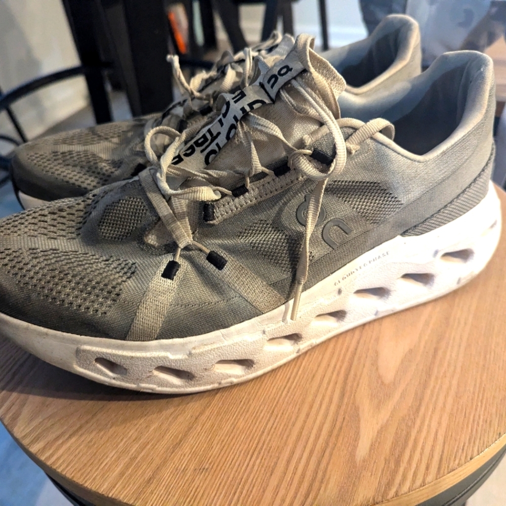 On Running Gray and White Athletic Shoes